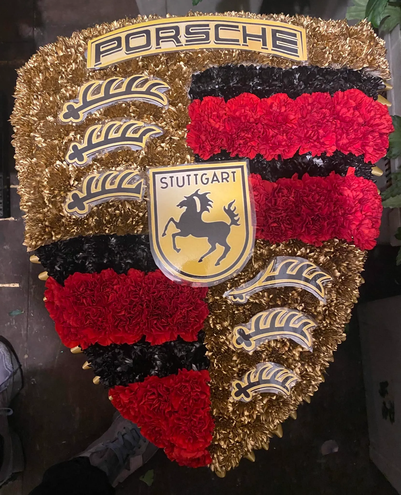 A bunch of flowers that are in the shape of a shield.