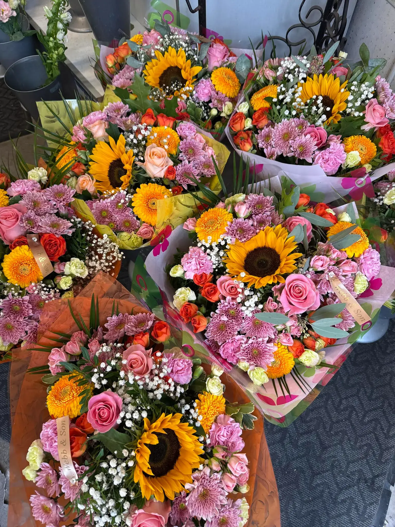 A bunch of flowers that are sitting on a table.