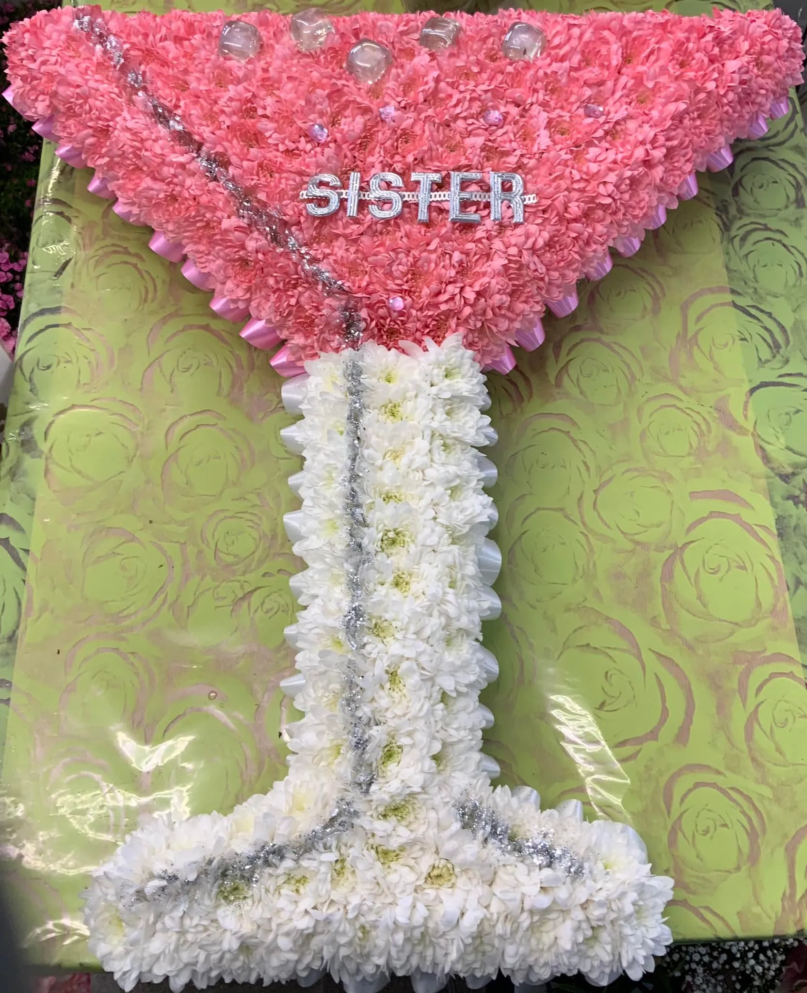 A cake shaped like a umbrella on a table.
