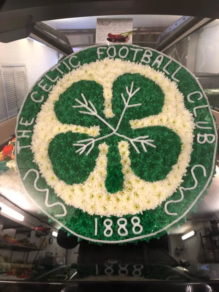 A cake decorated with a four leaf clover.