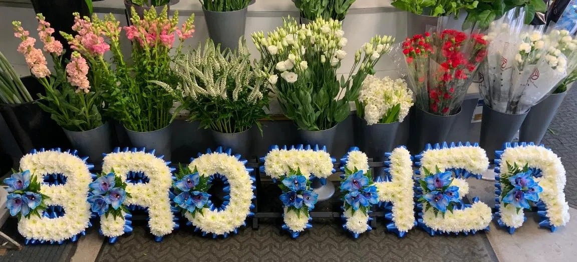 A bunch of flowers that are in the shape of letters.