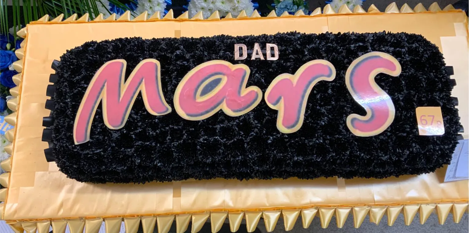 A cake with the word mars written on it.