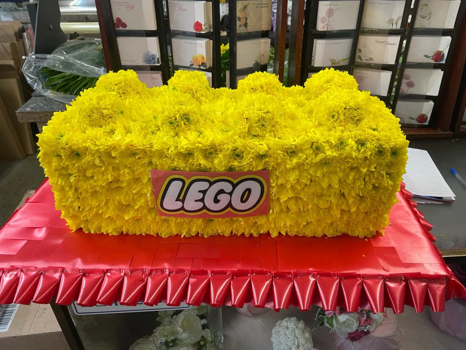 A bunch of yellow flowers sitting on top of a table.
