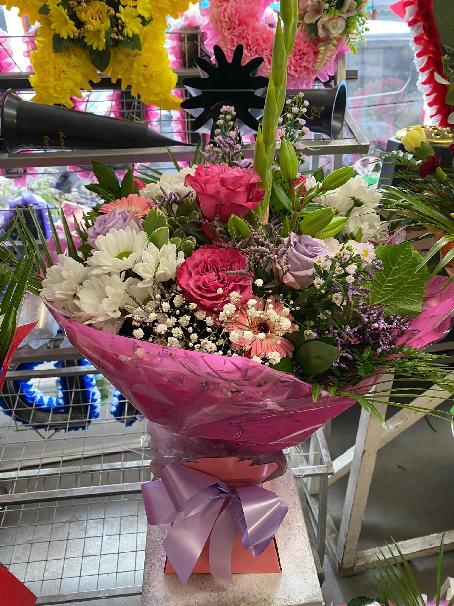 A bouquet of flowers sitting on top of a table.