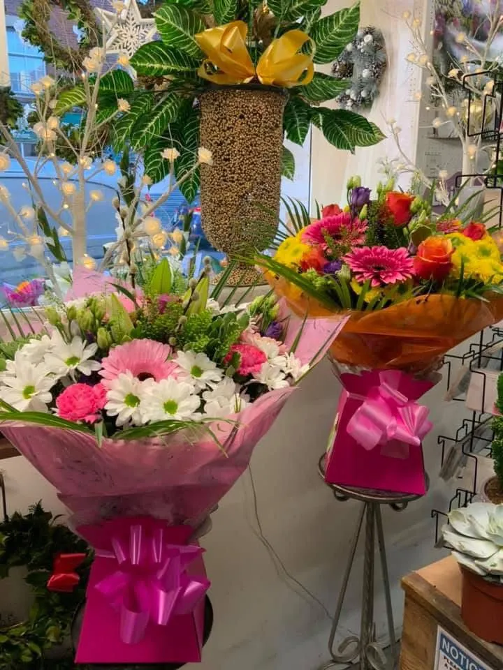 A bunch of flowers that are sitting on a table.